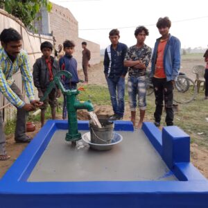 Surface well with hand pump - cement basin